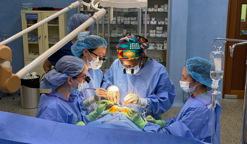 doctors in scrubs performing surgery